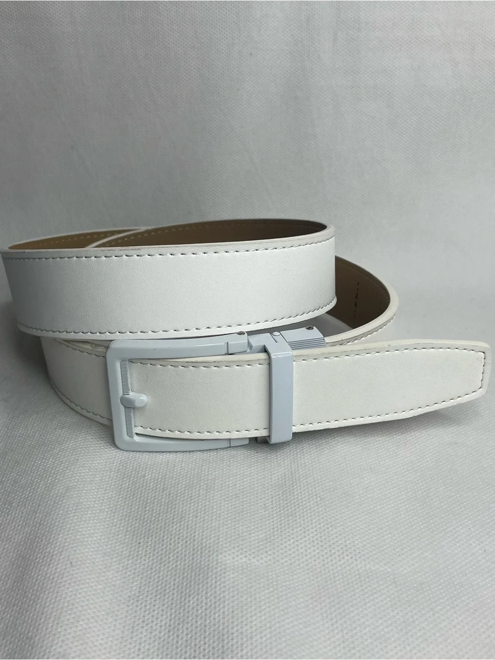 Nexbelt No Holes Ratchet Golf Belt Cut at 33” Grain Leather Mens White Metal Tan
